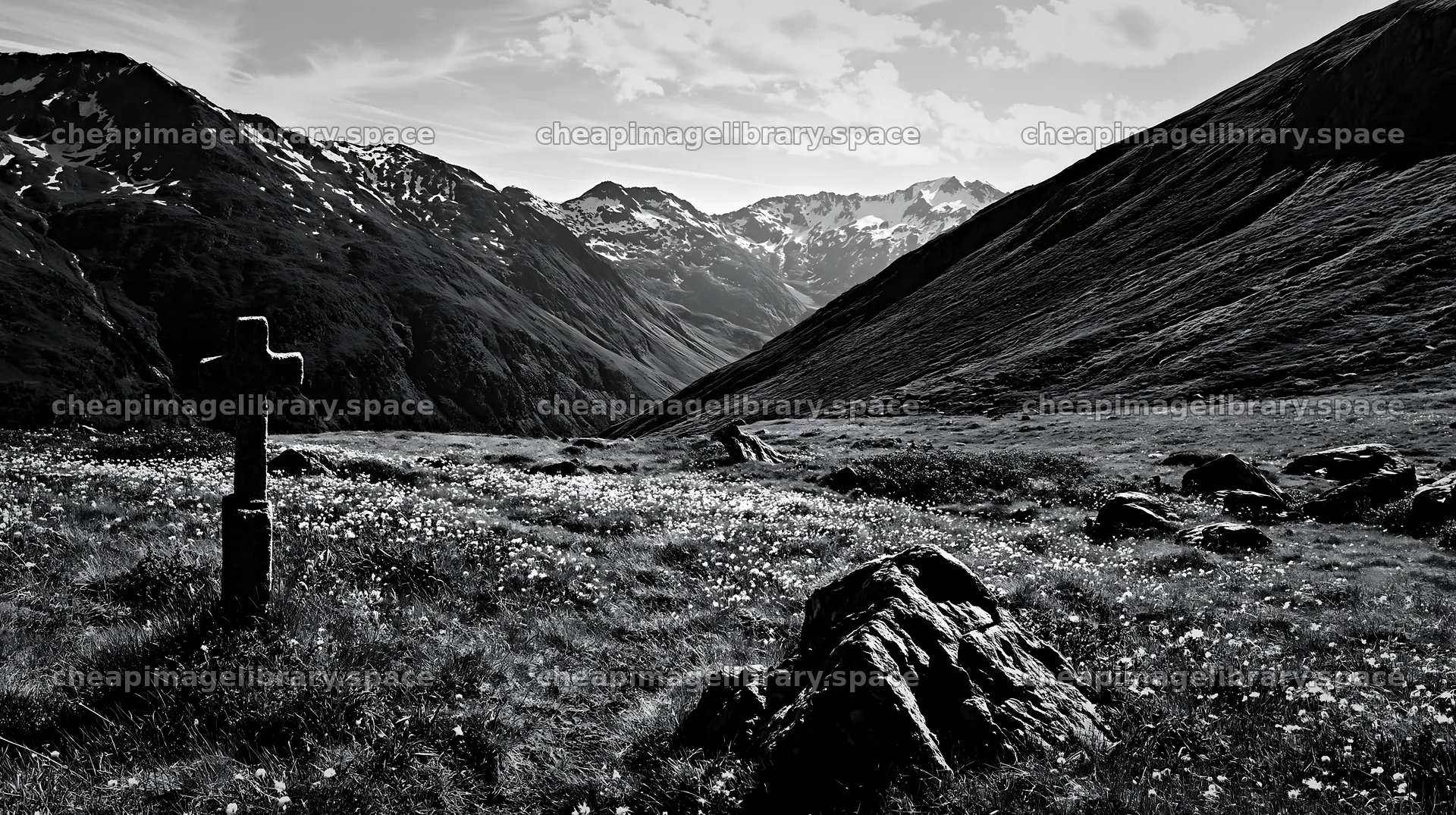 Stone Christian cross in alpine valley meadow – image library 10608x5938