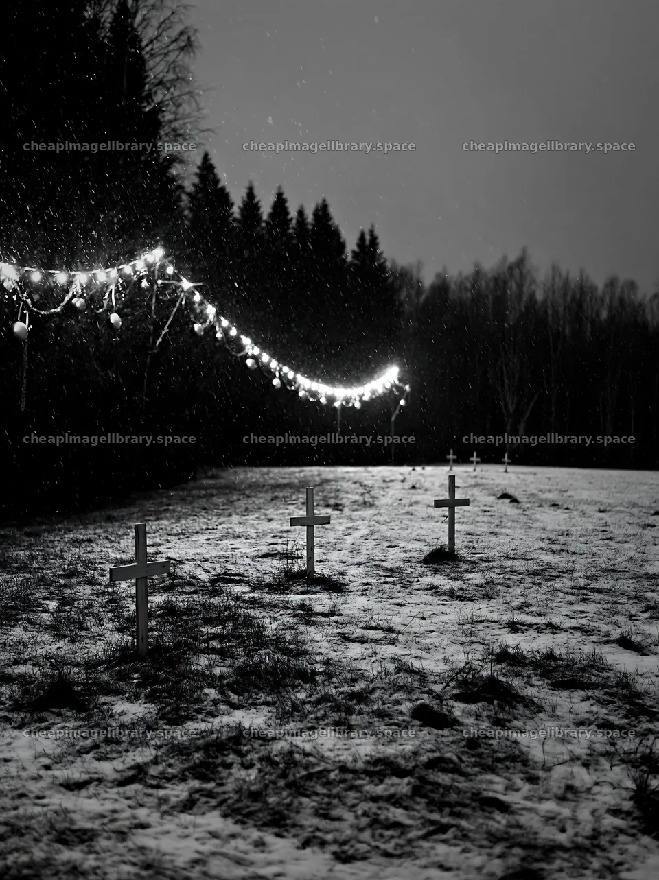 Multiple Christian crosses in snowy meadow at night – image library 6866x9174