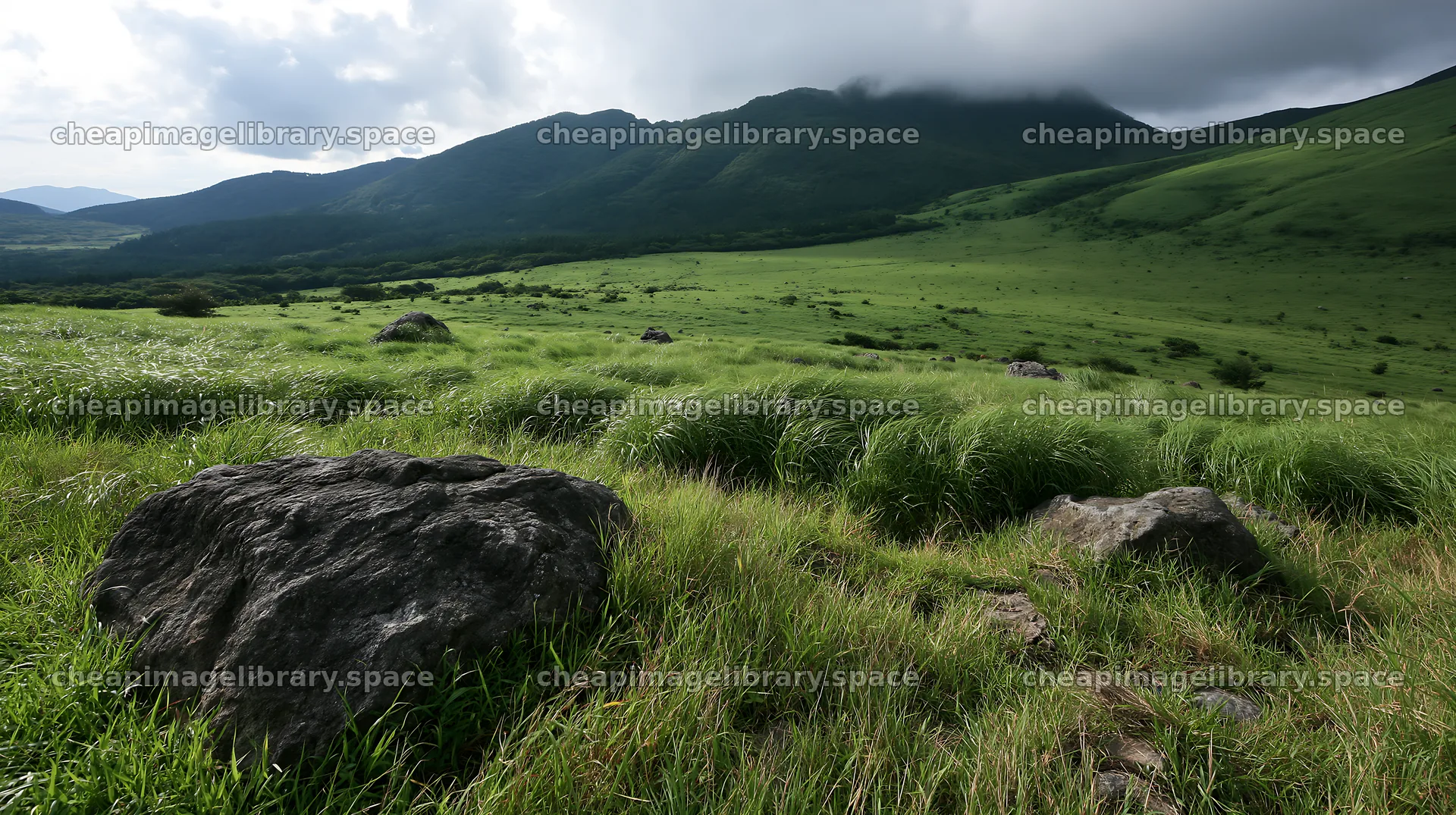 Oita highland meadow with granite stones in Japan – image library 10608x5938
