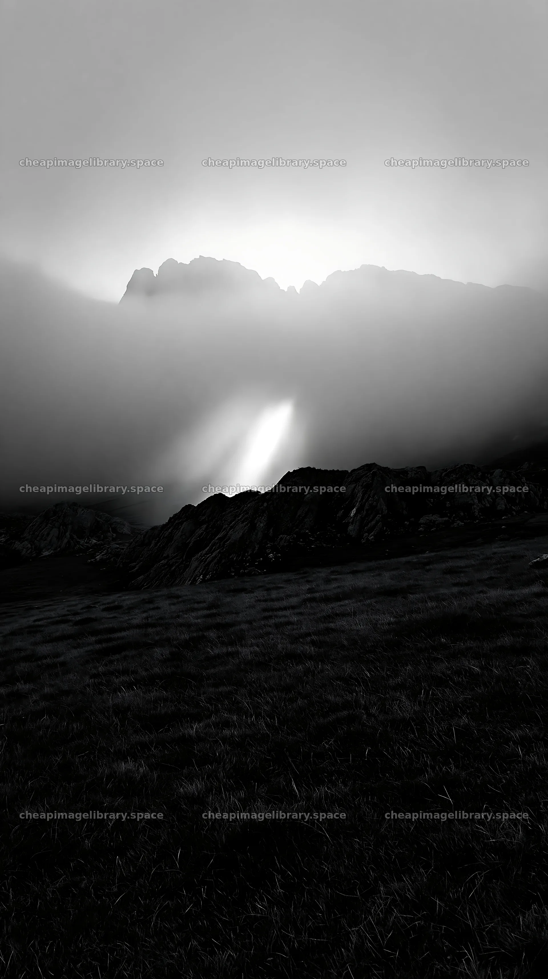 Picos de Europa meadow with sunrays through clouds – image library 5938x10608