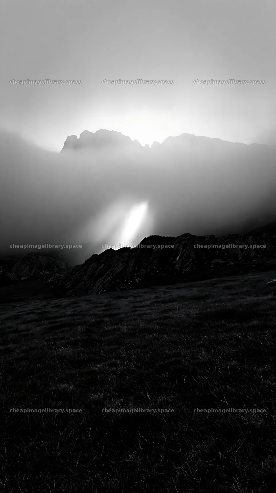 Picos de Europa meadow with sunrays through clouds – image library 5938x10608