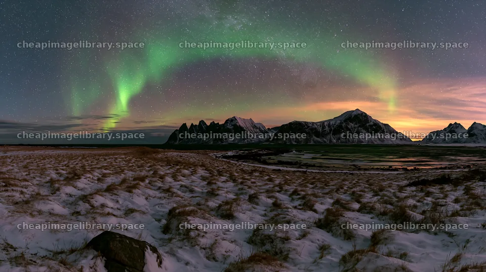 Lofoten coastal meadow winter snow with northern lights display – image library 10608x5938