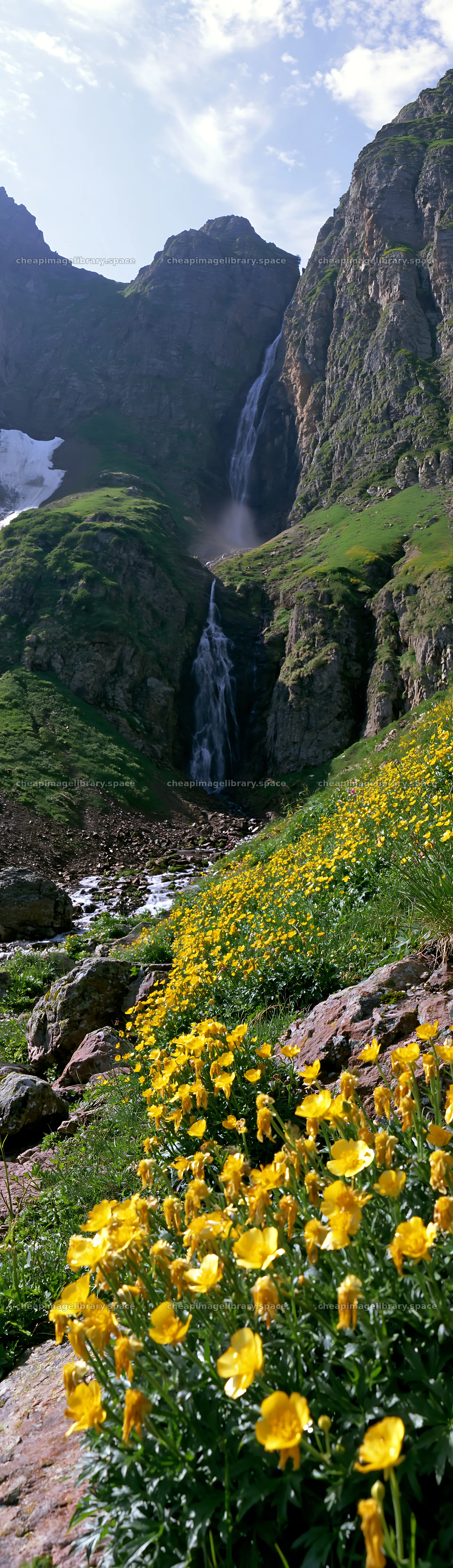 Alpine meadow and waterfall in a mountainous landscape – image library 4268x14762