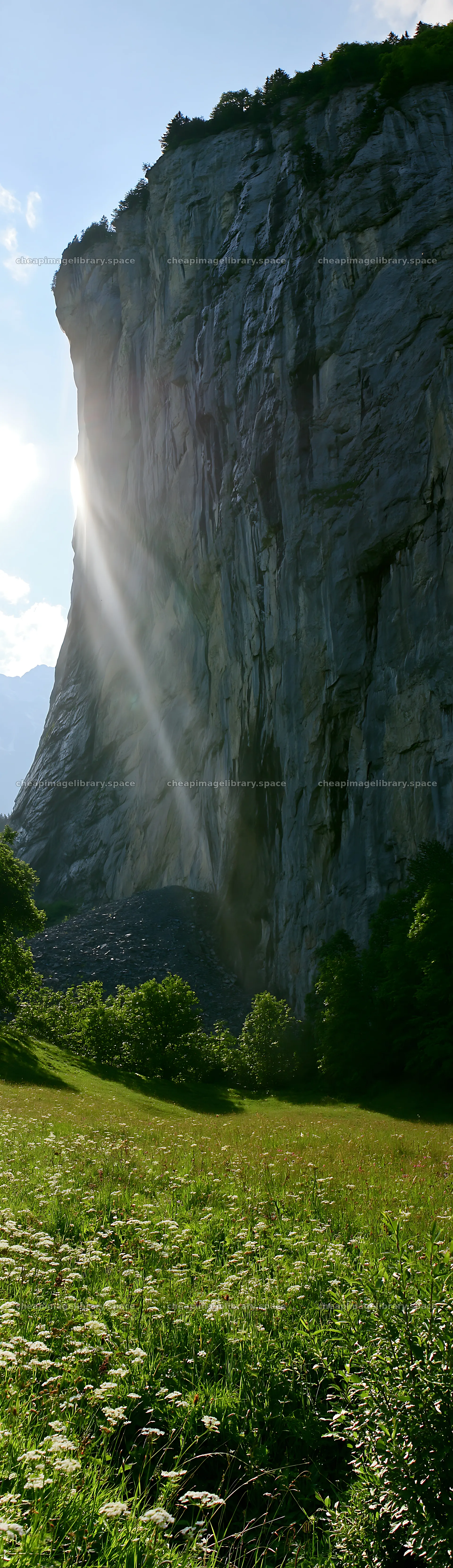 Lauterbrunnen Valley meadow light rays create a natural spectacle – image library 4268x14762