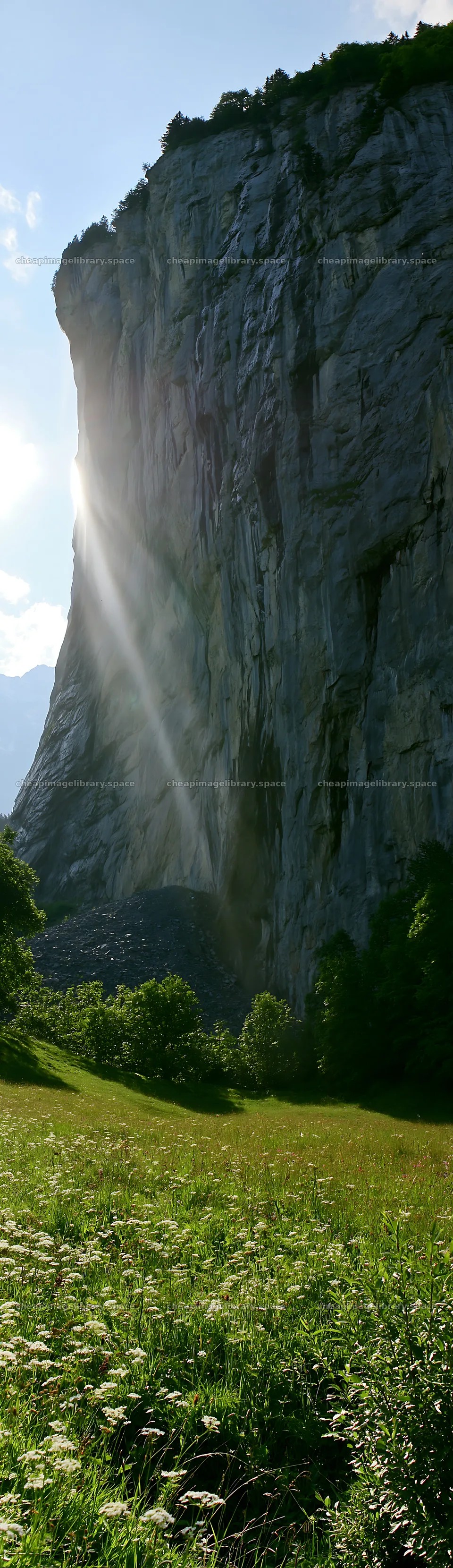 Lauterbrunnen Valley meadow light rays create a natural spectacle – image library 4268x14762