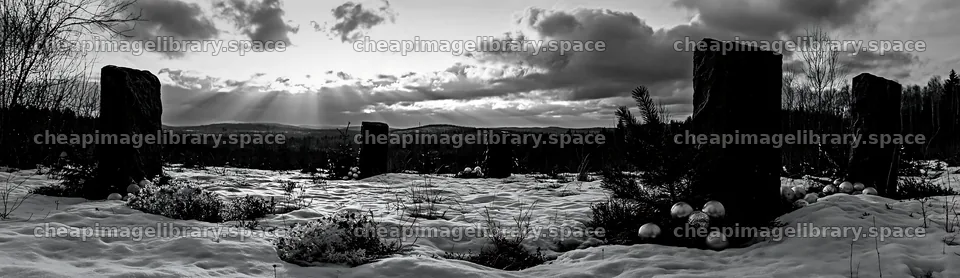 Snowy meadow with Christmas ornaments under rays from clouds – image library 14762x4268