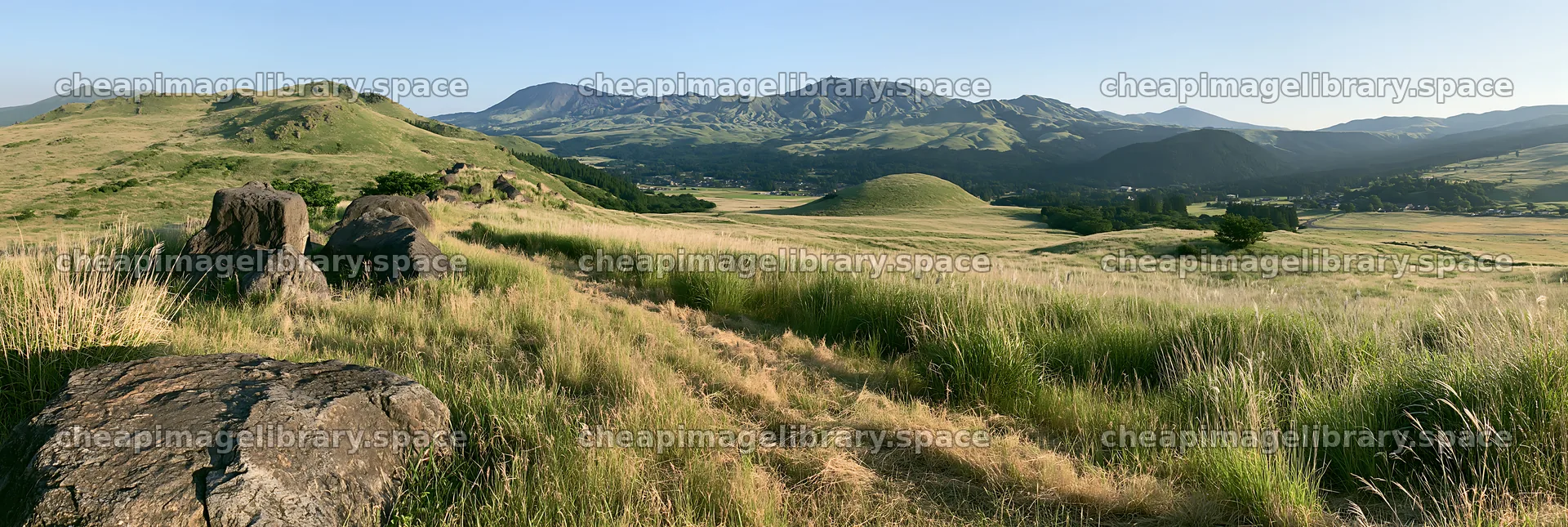 Restored Kumamoto silver grass meadow with boulders and hills – image library 13690x4602
