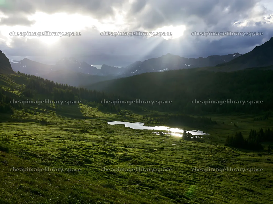 Sunshine rays over meadows in Banff National Park – image library 9174x6866