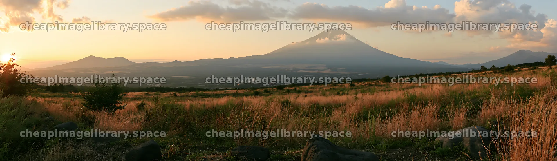 Yamanashi regenerative meadow with basalt stones at sunset – image library 14762x4268