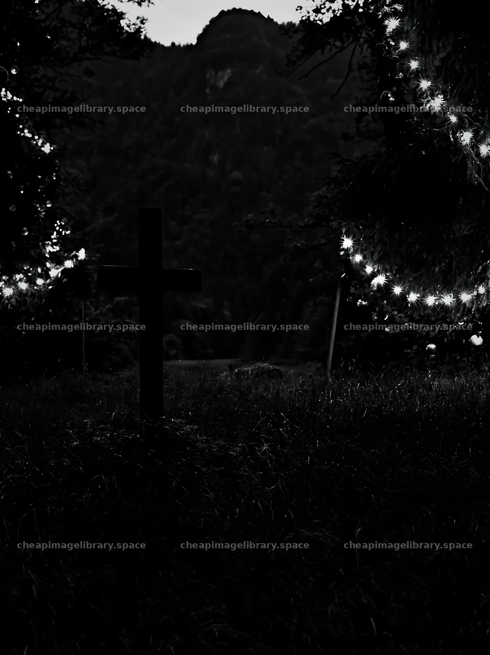 Wooden Christian cross in mountain meadow at night – image library 6866x9174