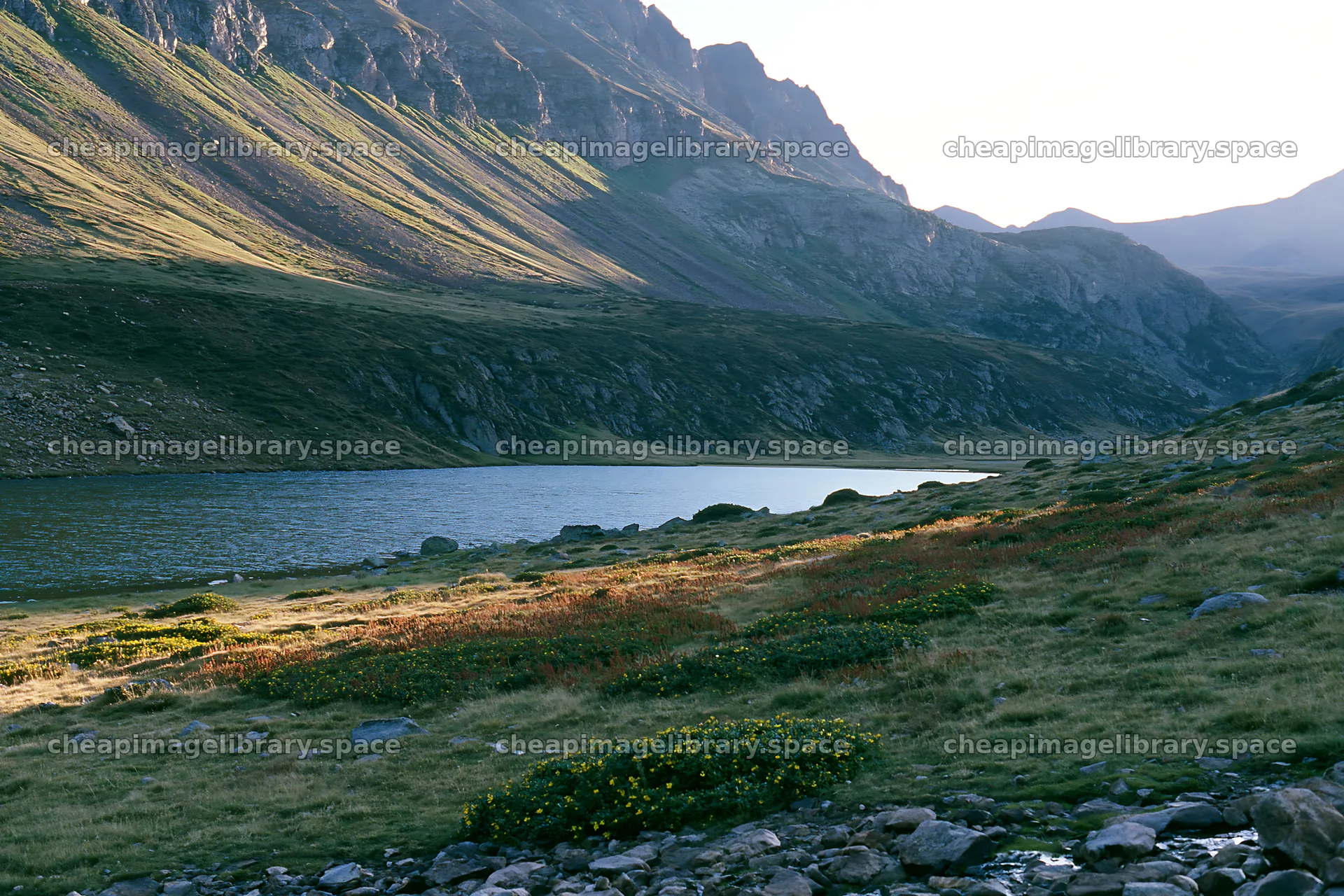Celestial meadow lake with mountains in the background – image library 9722x6480
