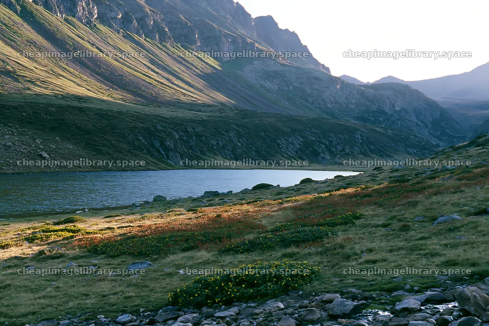 Celestial meadow lake with mountains in the background – image library 9722x6480