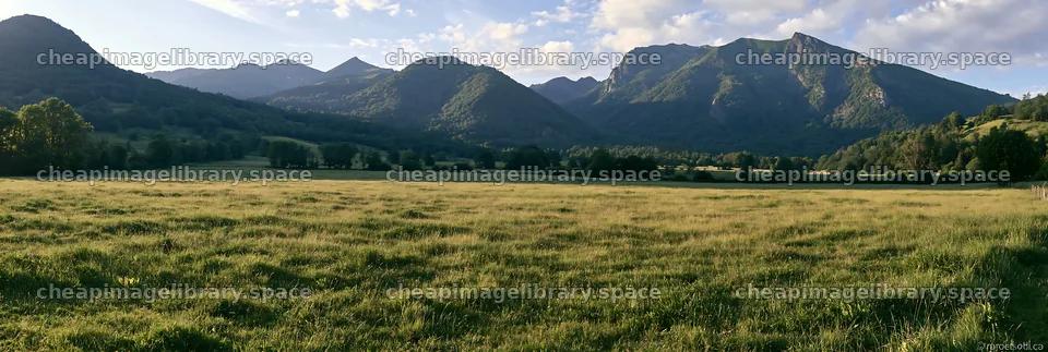 French meadow below Pyrenees range in a natural setting – image library 13690x4602